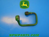 Used  John Deere 670, AM876883 SCV PUMP LINE